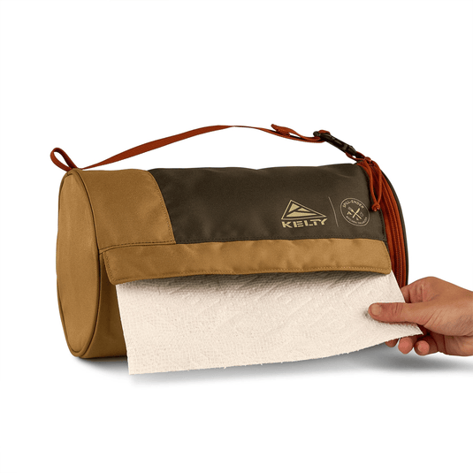Brown and beige bag with a towel being pulled out, featuring the Kiely brand.