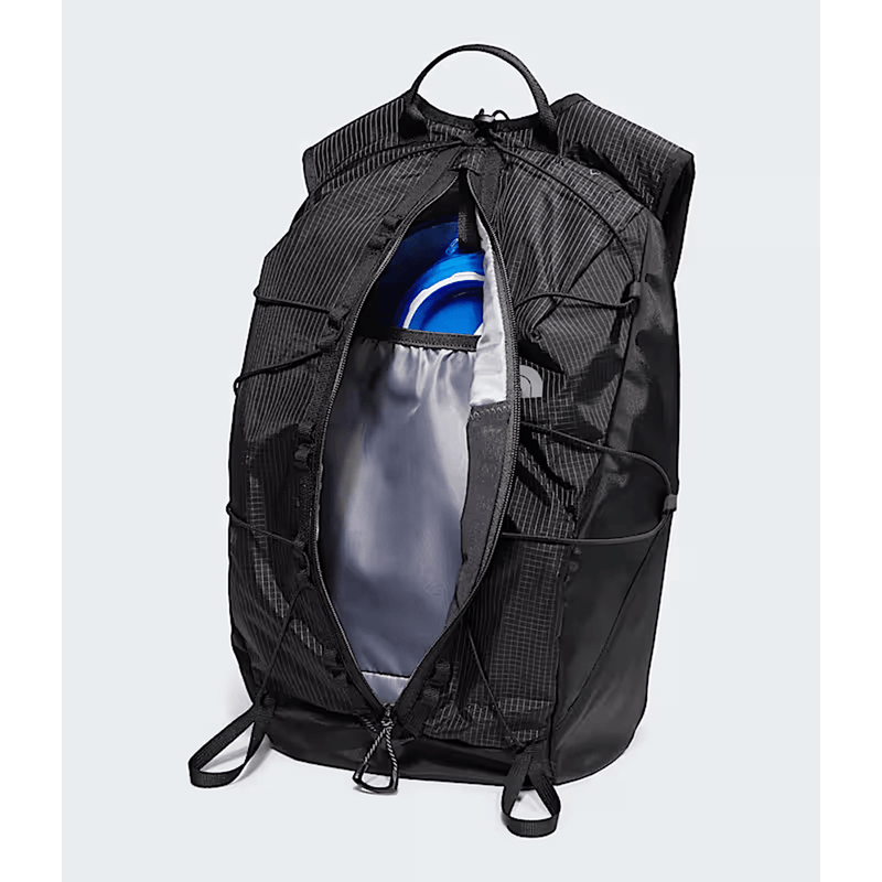 Load image into Gallery viewer, Black backpack with compartments on a light gray background
