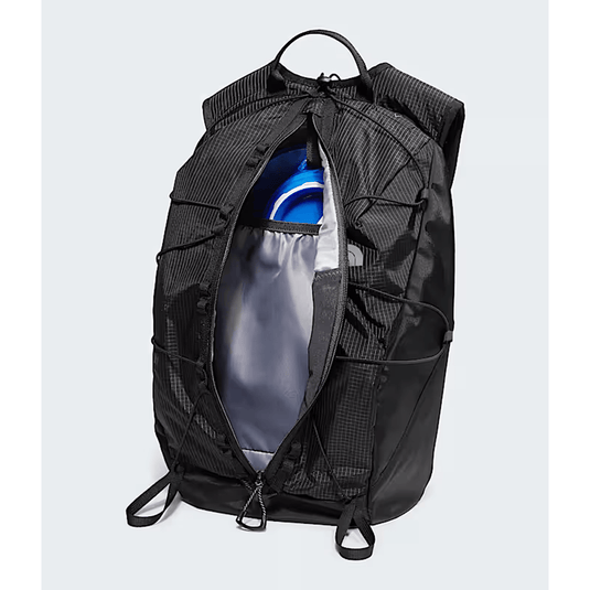 Black backpack with compartments on a light gray background