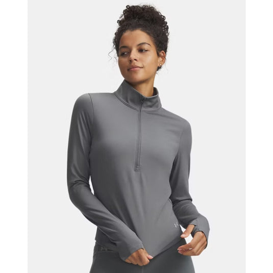 Woman wearing a gray long-sleeve athletic top on a white background