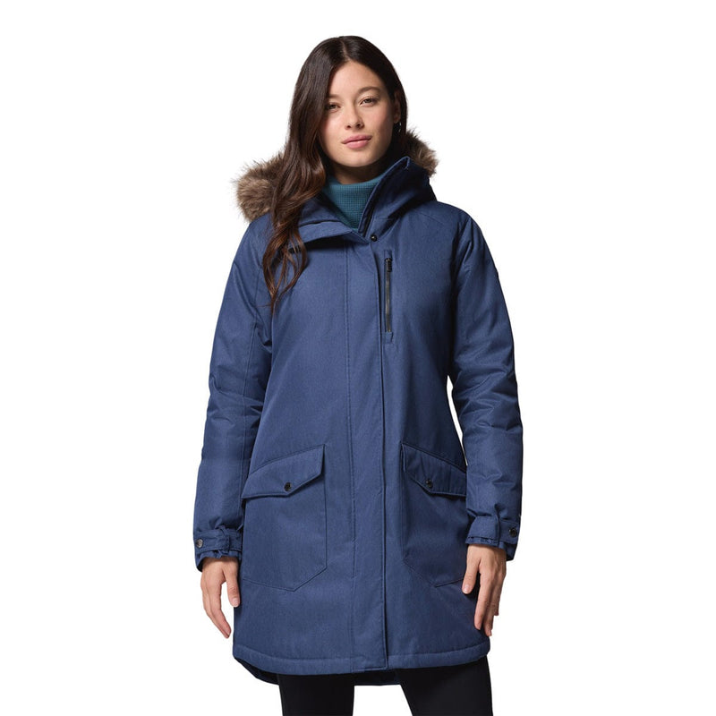 Load image into Gallery viewer, Woman wearing a blue winter coat with fur hood on a white background
