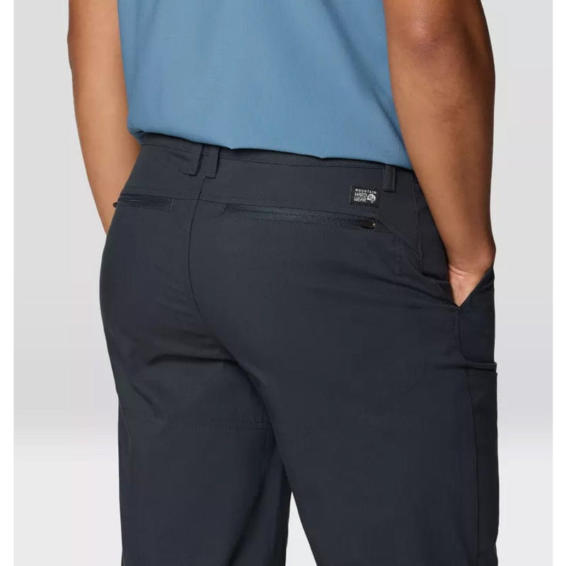 Load image into Gallery viewer, Person wearing dark gray pants with a visible brand logo on a light gray background
