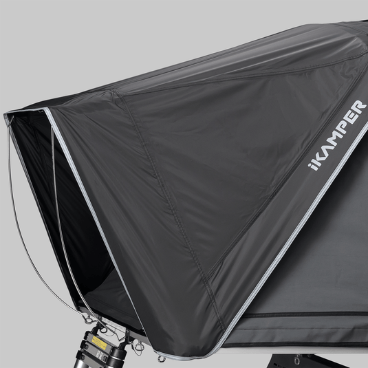 Black awning with 'ikamper' branding on a gray background