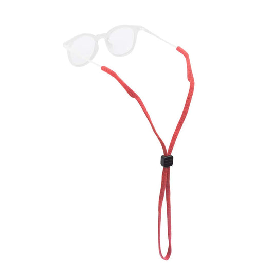 Clear eyeglasses with a red cord on a white background