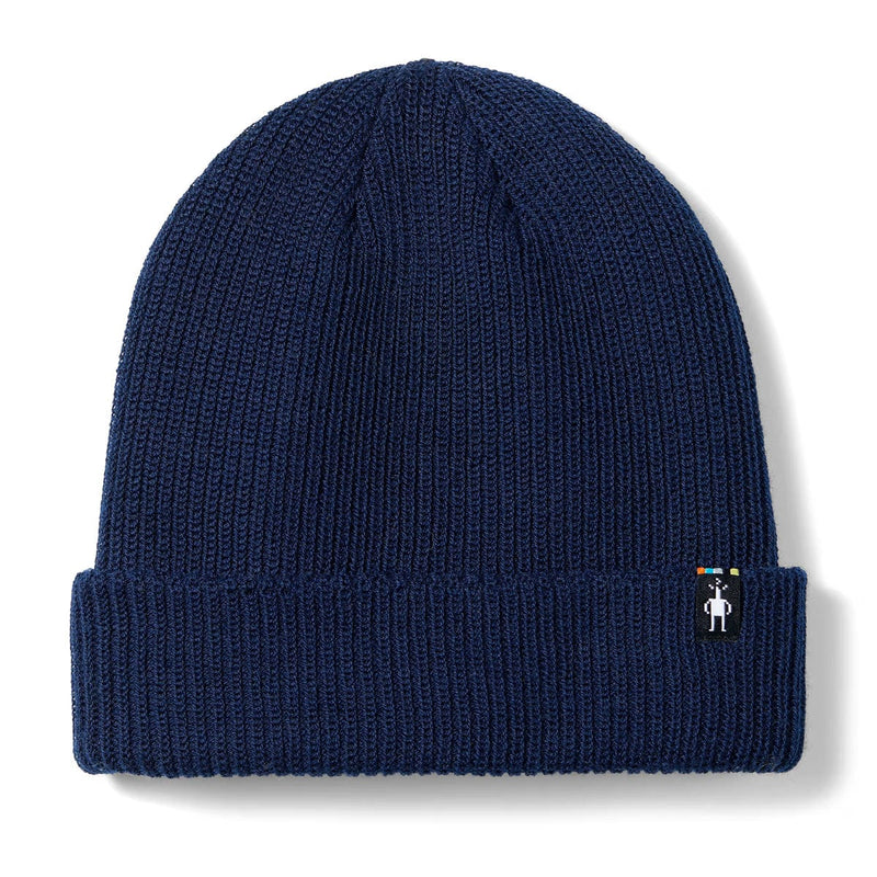Load image into Gallery viewer, Navy blue knit beanie with a small logo on a white background
