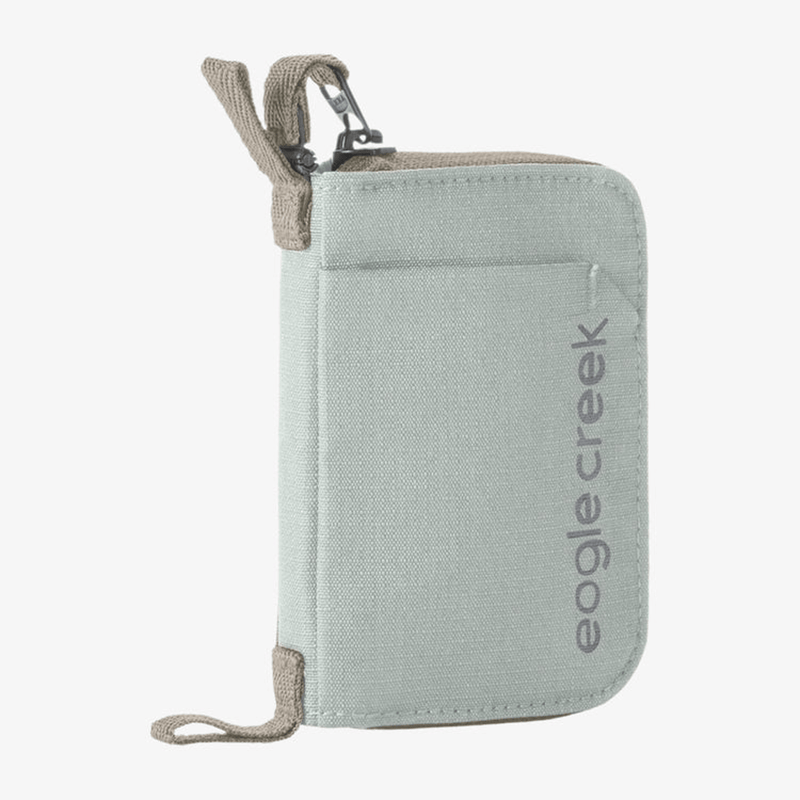Load image into Gallery viewer, Light gray travel wallet with beige accents and 'eagle creek' branding on a white background
