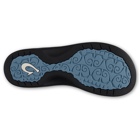 Close-up of a shoe sole with a brand logo on a white background