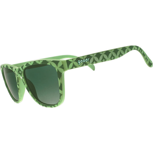 Green sunglasses with patterned arms on a white background