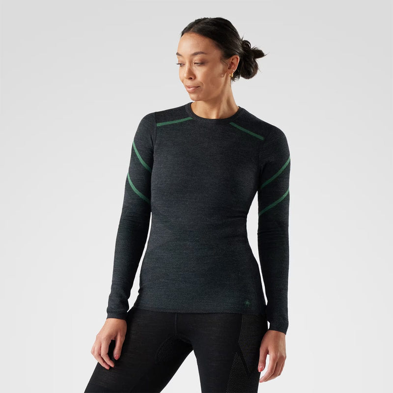 Load image into Gallery viewer, Person wearing a black and green long-sleeve athletic shirt on a white background
