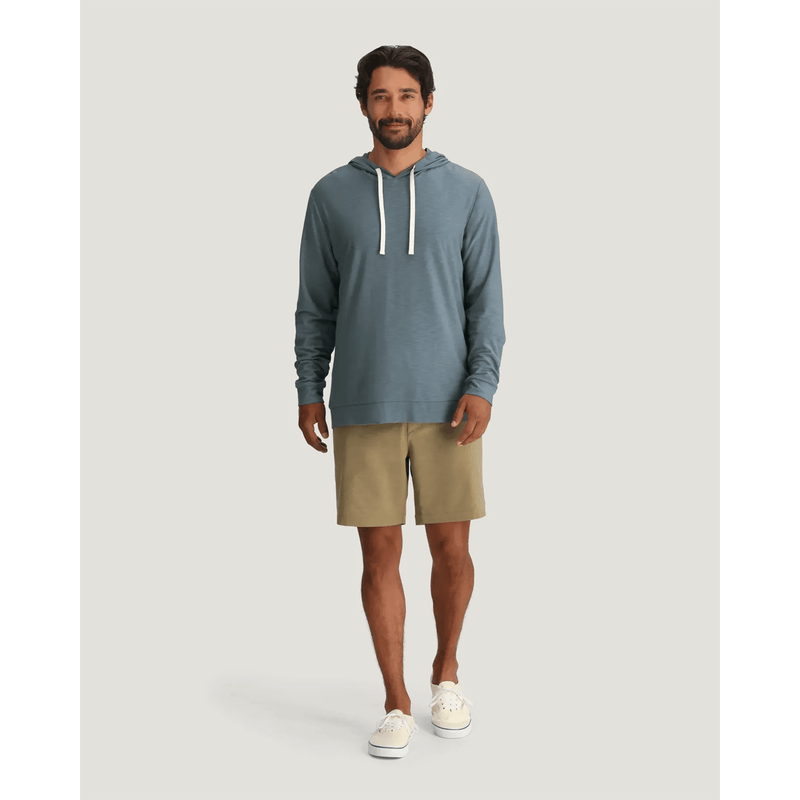 Load image into Gallery viewer, Man wearing a blue hoodie and beige shorts on a white background
