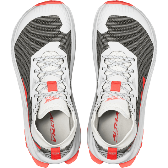 Pair of gray and white running shoes with red accents on a white background