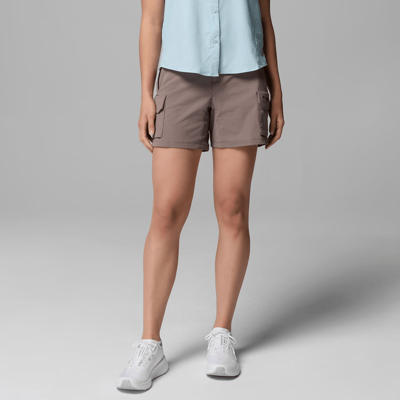 Load image into Gallery viewer, Person wearing brown shorts and a light blue top on a gray background
