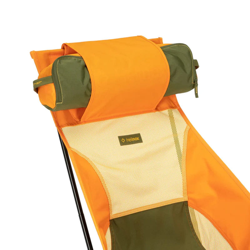 Load image into Gallery viewer, Orange and green camping chair with a visible Helinox logo on a white background
