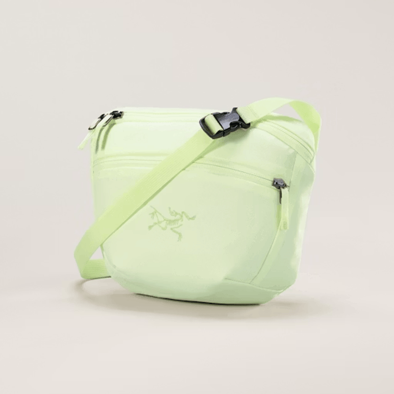Load image into Gallery viewer, Light green waist bag with a brand logo on a light gray background

