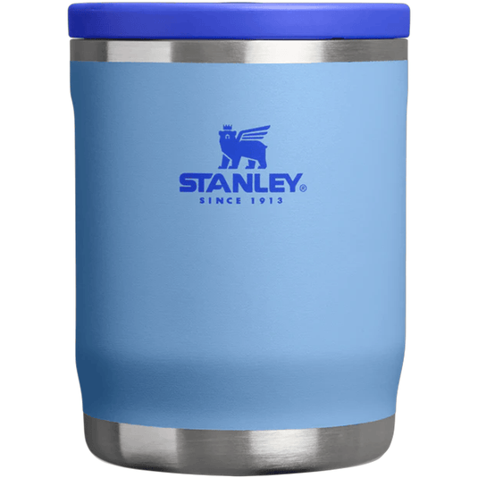 Blue Stanley tumbler with a silver base and lid on a white background