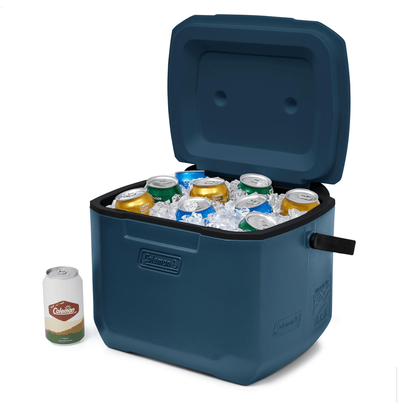 Load image into Gallery viewer, Blue cooler with open lid showing ice and cans, next to a can of beer on a white background
