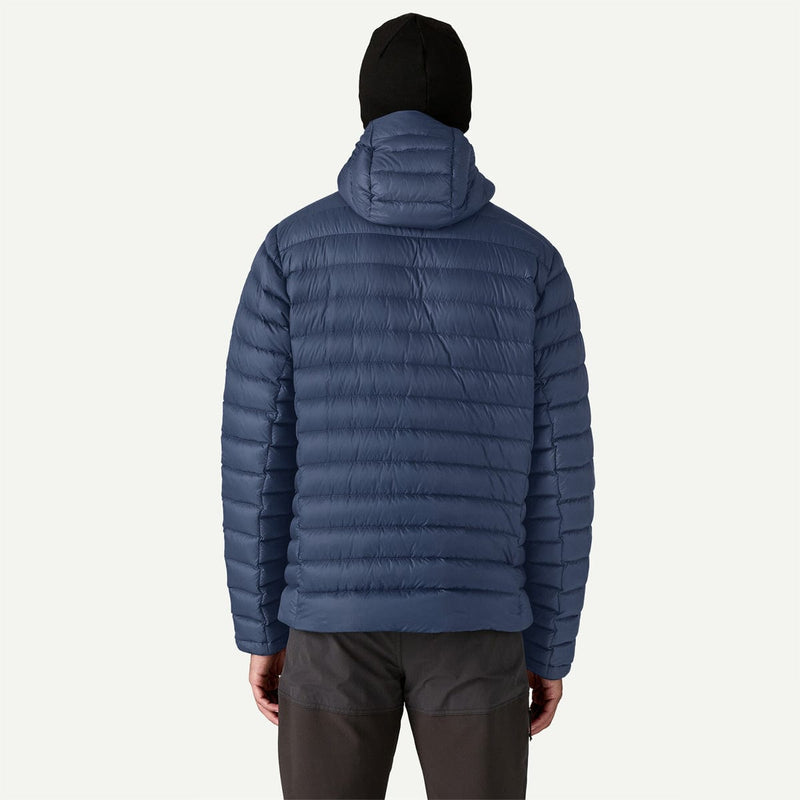Load image into Gallery viewer, Person wearing a blue puffer jacket on a white background
