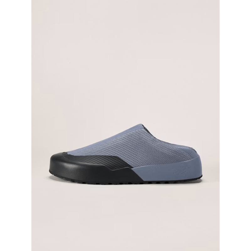 Load image into Gallery viewer, Blue and black slip-on shoe on a beige background
