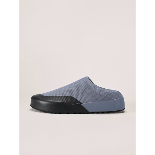 Blue and black slip-on shoe on a beige background