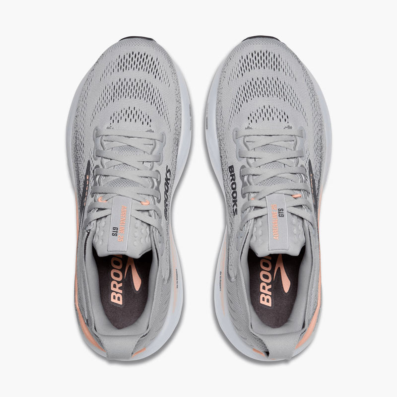 Load image into Gallery viewer, Pair of gray running shoes with 'Brooks' branding on a white background
