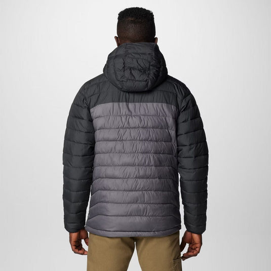 Person wearing a gray puffer jacket on a white background