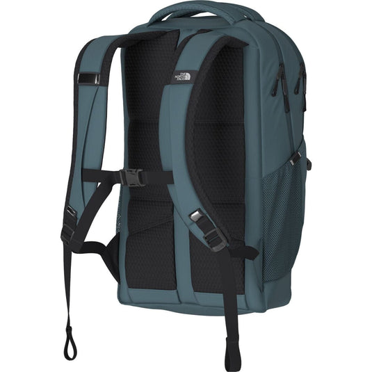 Green backpack with black straps on a white background