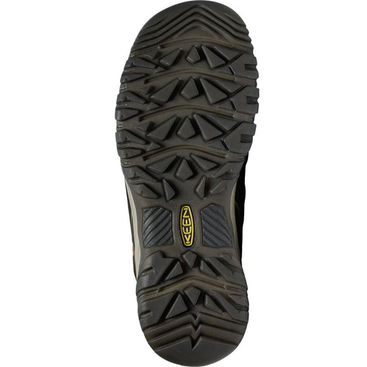 Close-up of a hiking boot sole with brand logo on a white background
