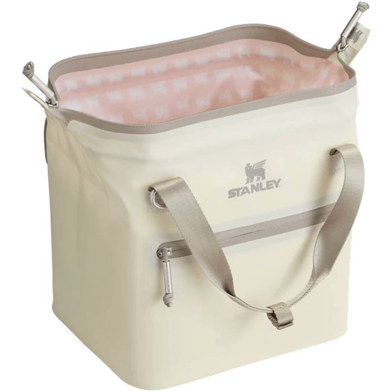 Load image into Gallery viewer, Beige cooler bag with pink interior and Stanley logo on a white background
