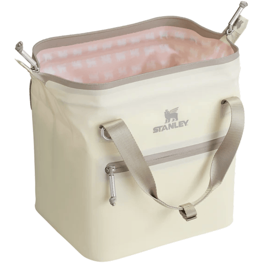 Beige cooler bag with pink interior and Stanley logo on a white background