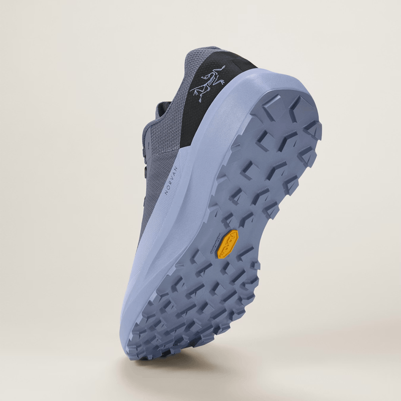 Load image into Gallery viewer, Blue hiking shoe with a textured sole on a beige background

