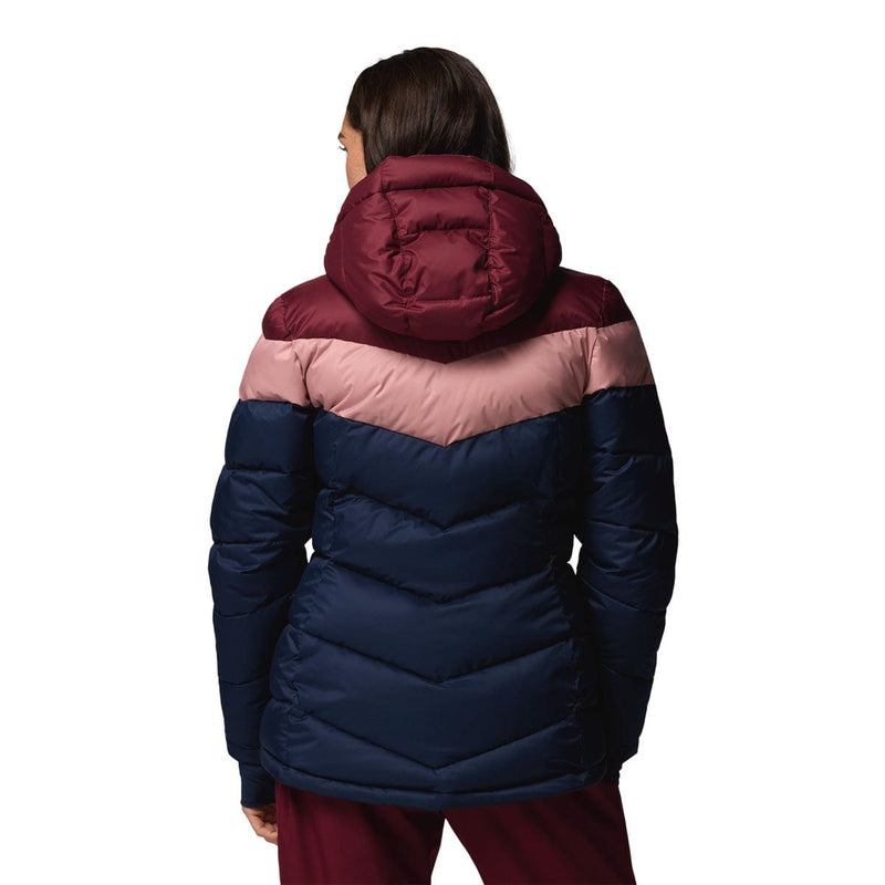 Load image into Gallery viewer, Person wearing a two-tone puffer jacket with maroon and navy colors on a white background
