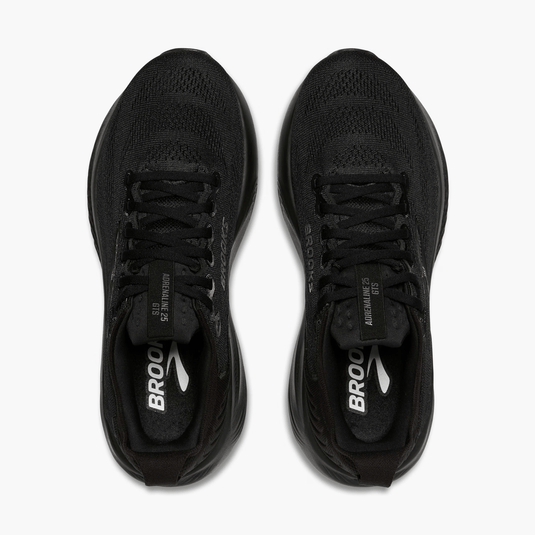 Black running shoes with visible branding on a white background