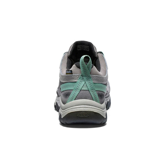 Gray shoe with green accents on a white background