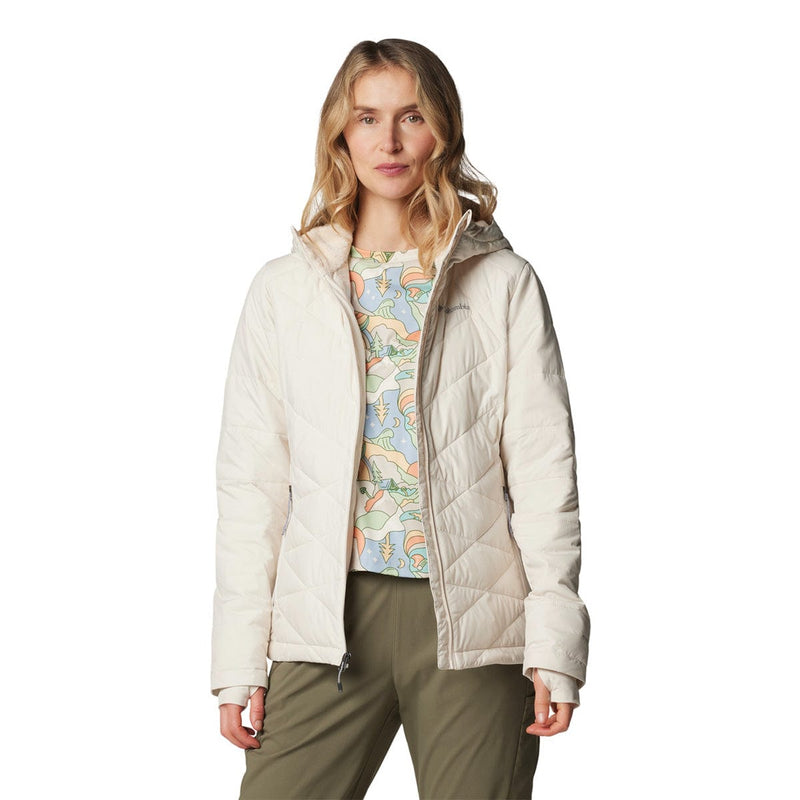 Load image into Gallery viewer, Woman wearing a beige puffer jacket over a colorful shirt on a white background

