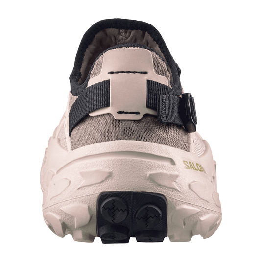 Back view of a gray shoe with black sole on a white background