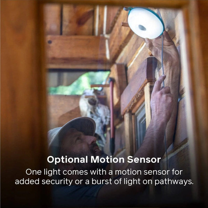 Load image into Gallery viewer, Person installing a light fixture with text about an optional motion sensor.

