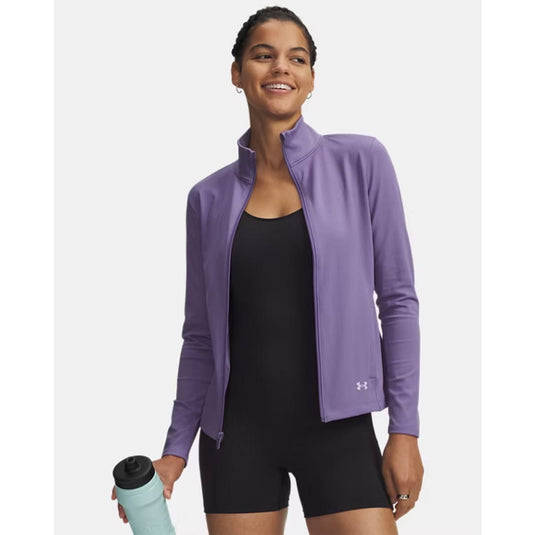 Woman wearing a purple jacket holding a water bottle on a white background