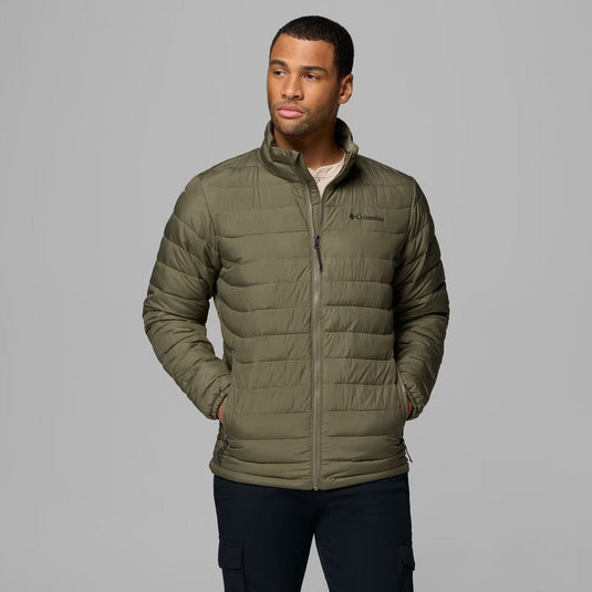 Man wearing a green puffer jacket with Columbia logo on a gray background
