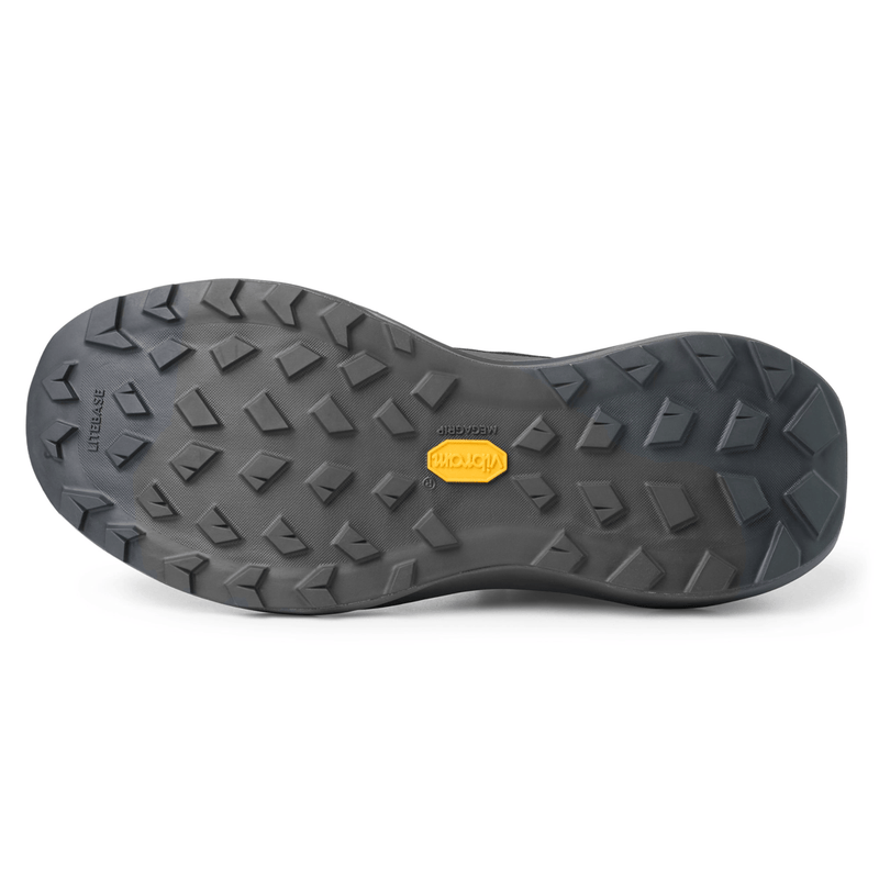 Load image into Gallery viewer, Close-up of a black shoe sole with a brand logo on a white background
