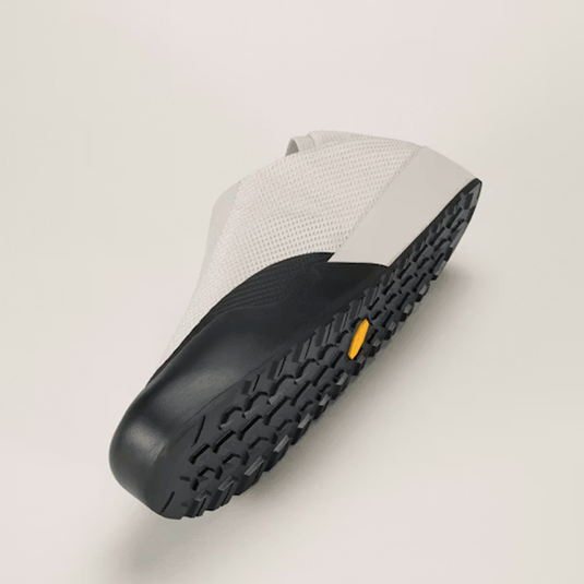 Black shoe sole with textured pattern on a light gray background