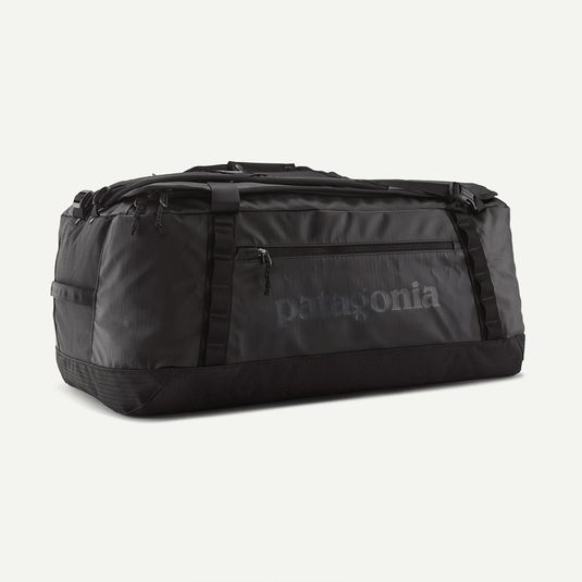 Black duffel bag with Patagonia logo on a light gray background