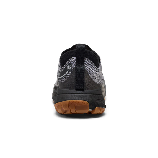 Back view of a black and gray athletic shoe with a brown sole on a white background
