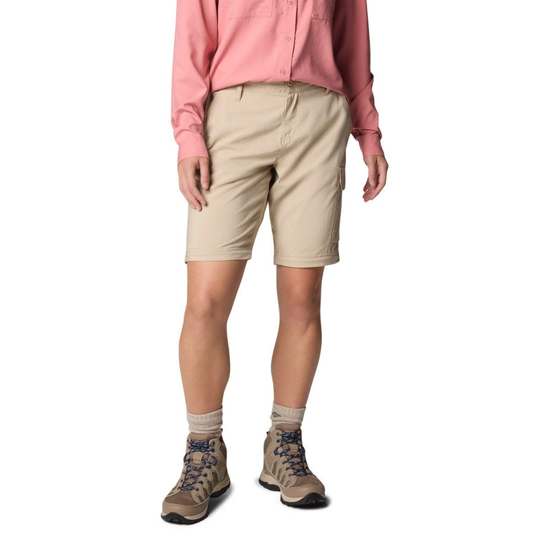 Load image into Gallery viewer, Person wearing beige shorts, pink shirt, and hiking boots on a white background
