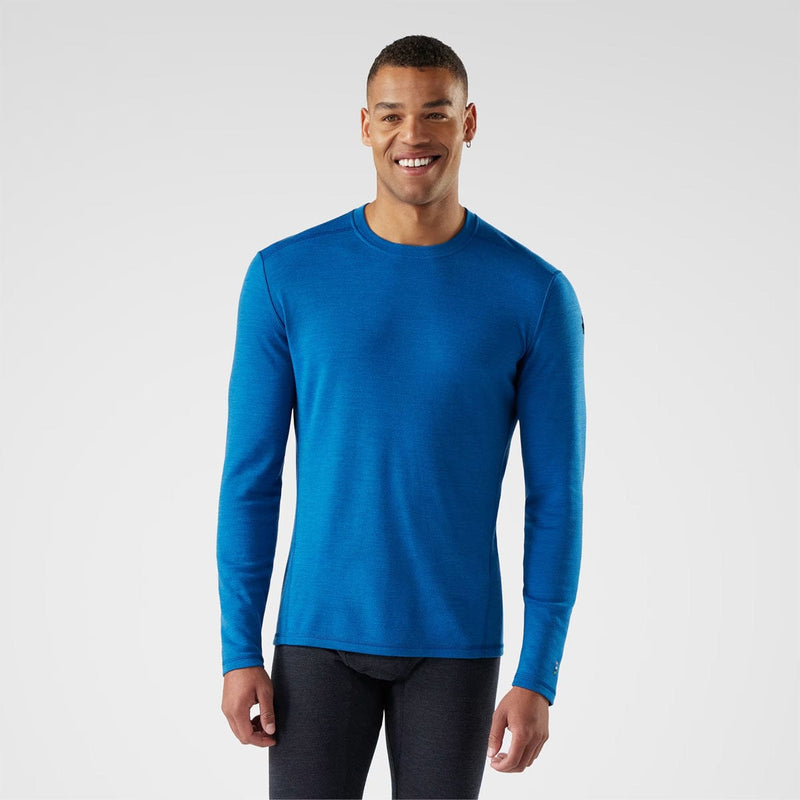 Load image into Gallery viewer, Man wearing a blue long-sleeve shirt on a white background
