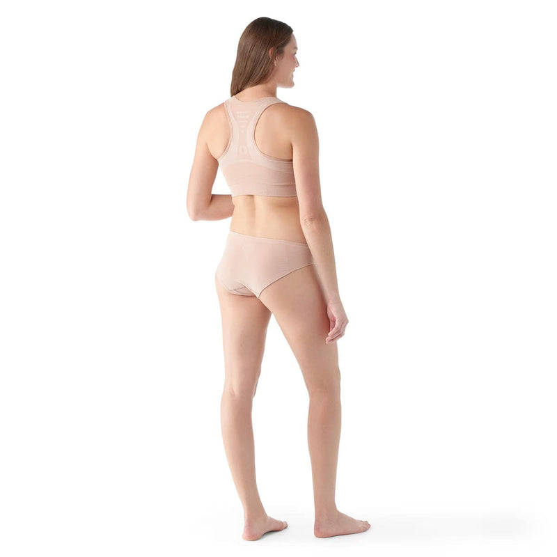 Load image into Gallery viewer, Woman wearing a beige sports bra and leggings on a white background
