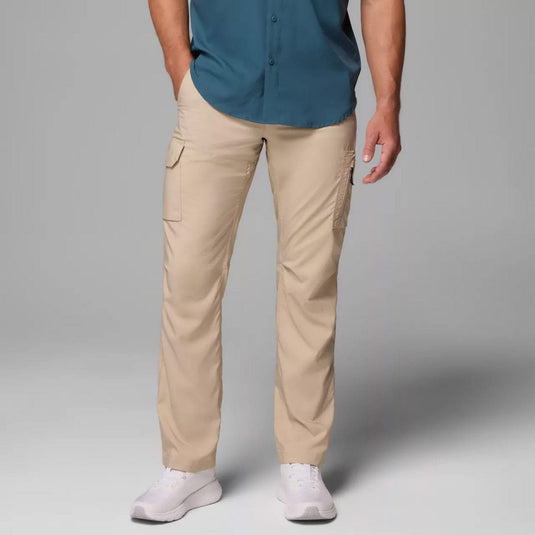 Person wearing beige pants and a blue shirt on a gray background