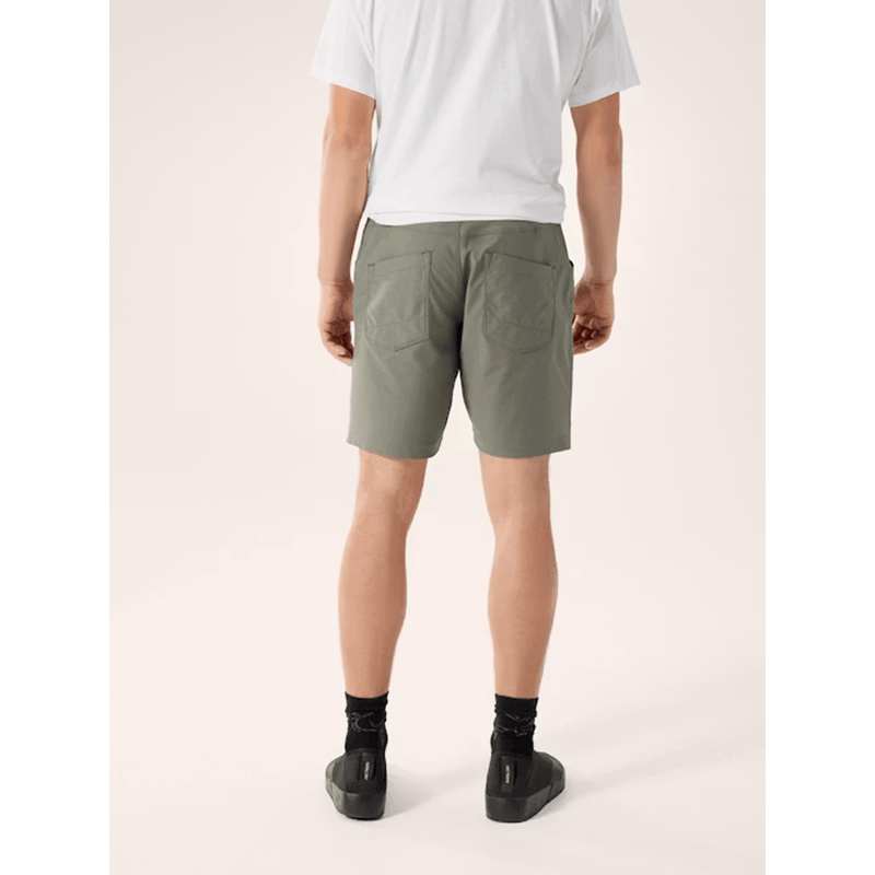 Load image into Gallery viewer, Person wearing olive green shorts on a white background

