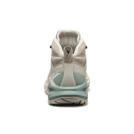 Light gray and green sneaker on a white background