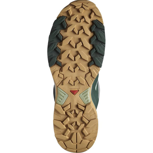 Close-up of a hiking shoe sole with tread pattern on a white background