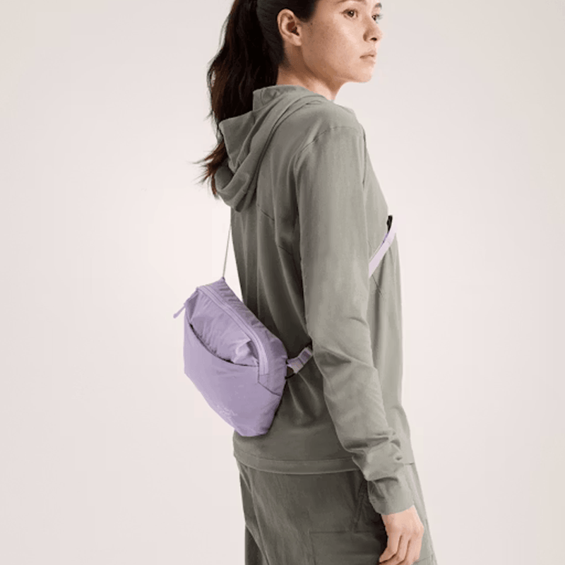 Load image into Gallery viewer, Person wearing a green hoodie with a purple bag on a plain background
